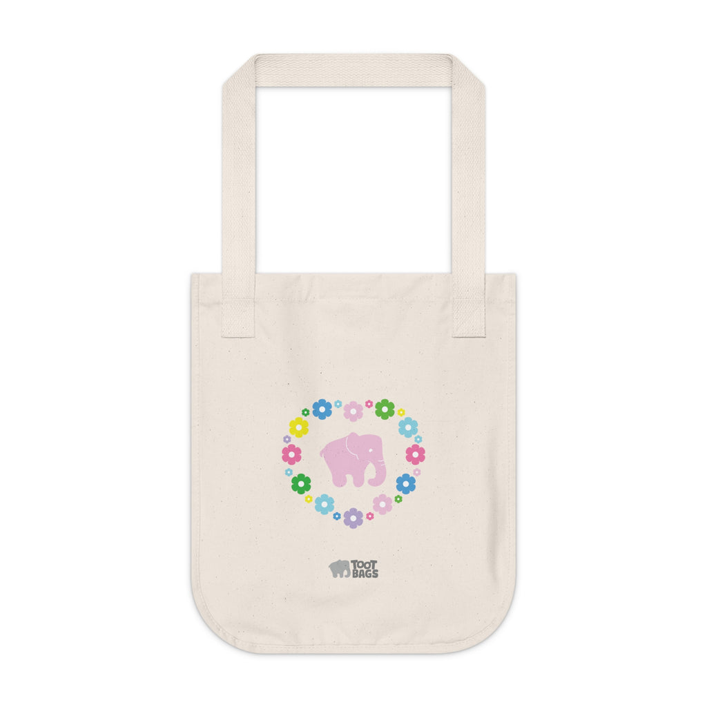 Natural beige canvas tote bag with a printed heart design featuring a pink elephant and colorful flowers on a white background.