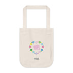 Natural beige canvas tote bag with a printed heart design featuring a pink elephant and colorful flowers on a white background.