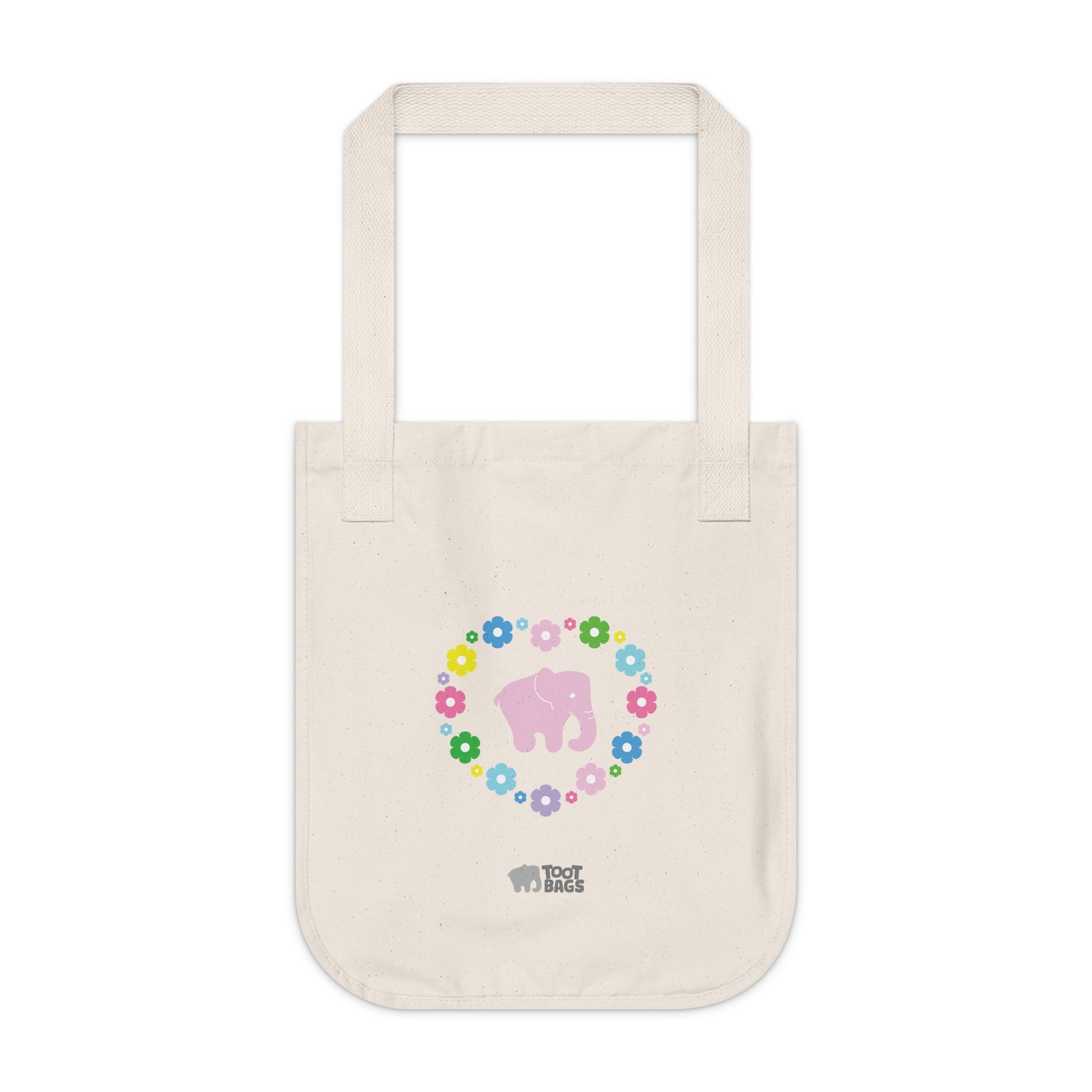 Natural beige canvas tote bag with a printed heart design featuring a pink elephant and colorful flowers on a white background.