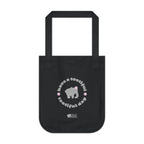 Black canvas tote bag with printed design featuring a gray elephant, gray 'have a tootiful tootiful day’ text with pink floral design on a white background.