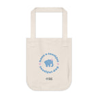 Natural beige canvas tote bag with a printed design featuring a blue elephant and 'have a tootiful tootiful day’ text with pink floral design on a white background.