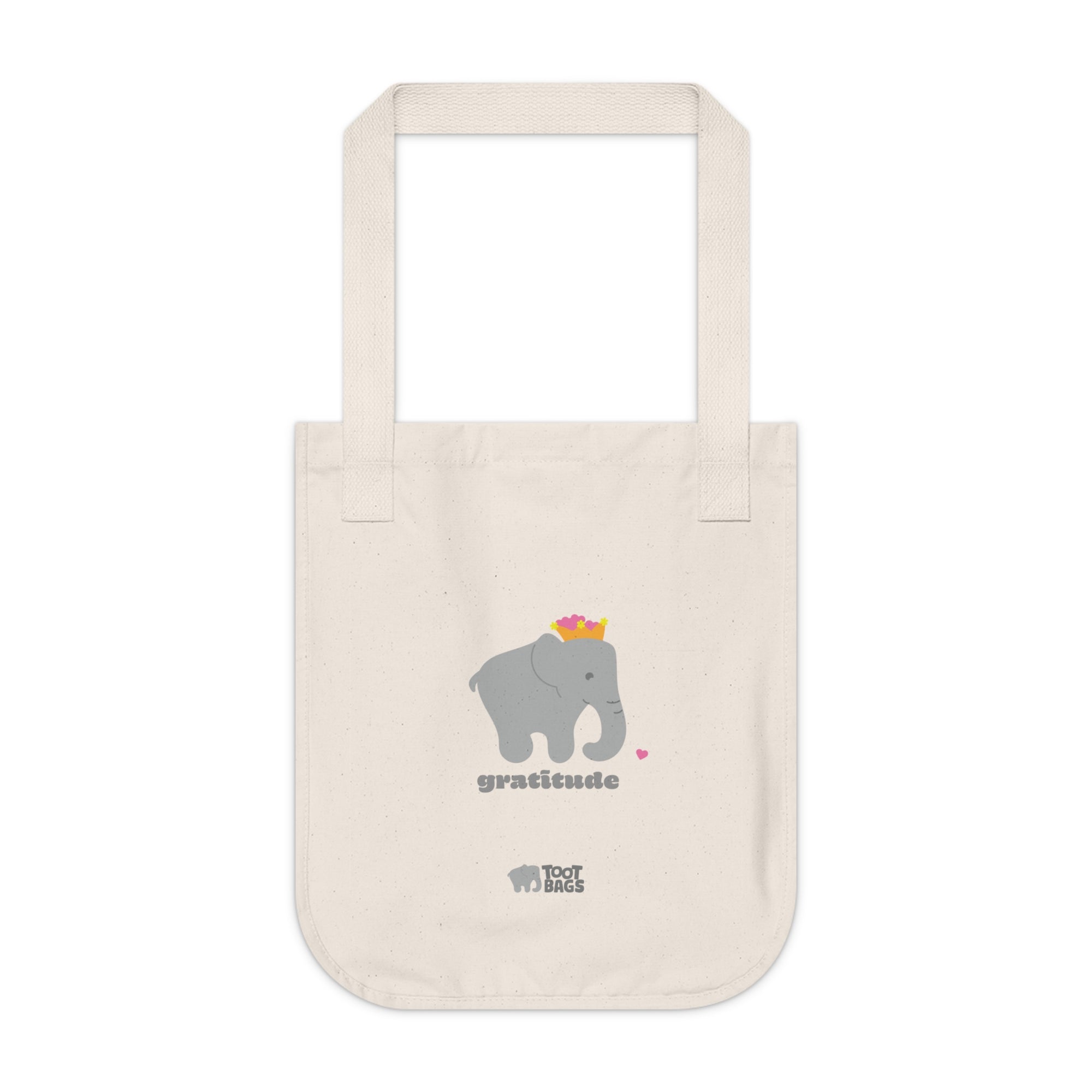 Natural beige canvas tote bag featuring printed design; a gray elephant, gray 'gratitude' text and colorful hearts on a white background.  