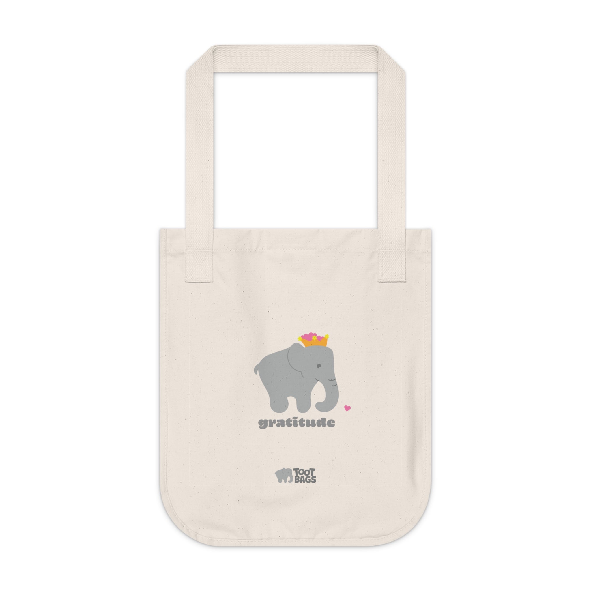 Natural beige canvas tote bag with printed design featuring a gray elephant, gray 'gratitude’ text with colorful hearts on a white background.