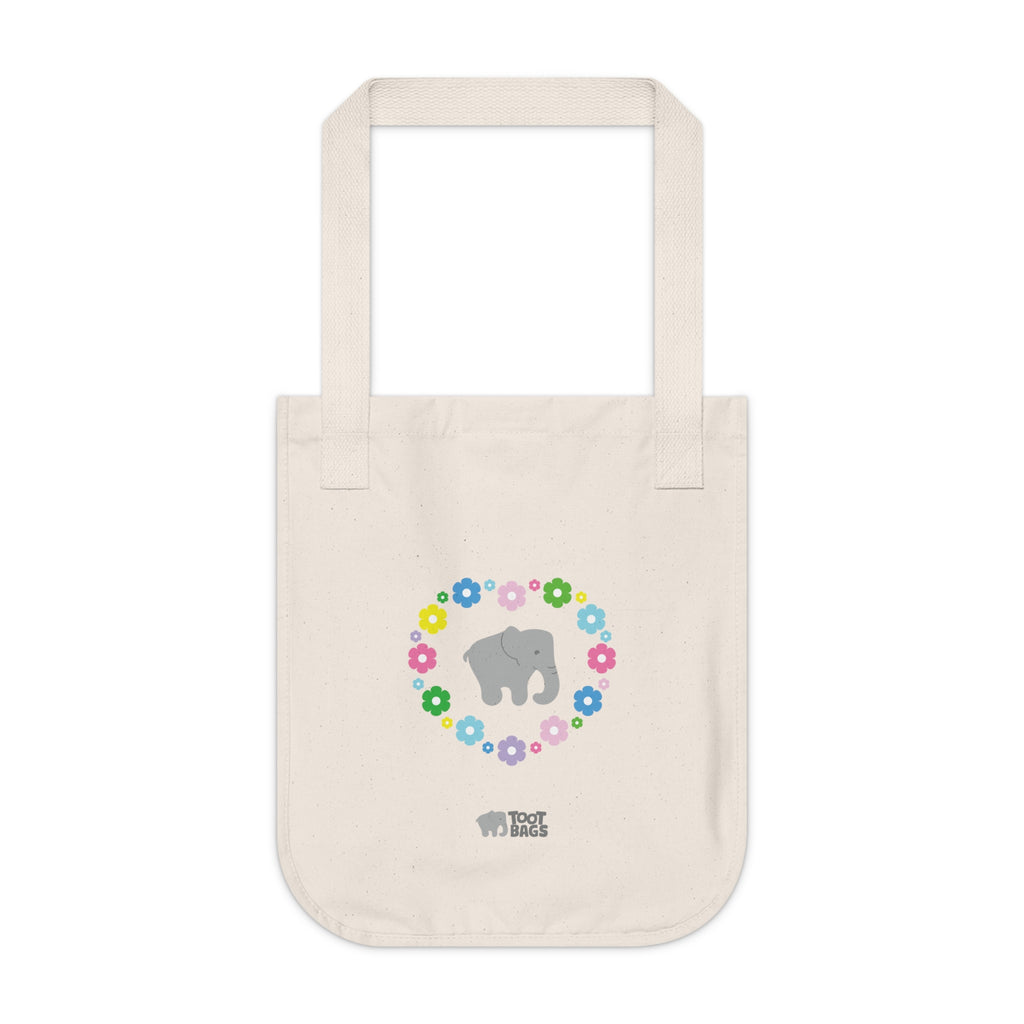 Natural beige canvas tote bag with a printed heart design featuring a gray elephant and colorful flowers on a white background.