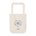 Natural beige canvas tote bag with a printed heart design featuring a gray elephant and colorful flowers on a white background.