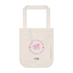 Natural beige canvas tote bag with printed design featuring a pink elephant, pink 'have a tootiful tootiful day’ text with colorful pink flowers on a white background.