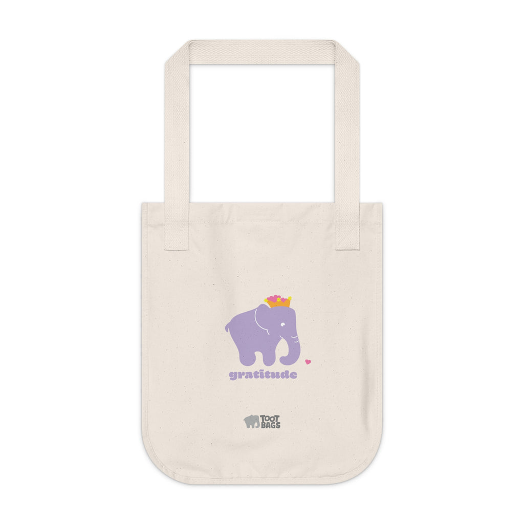 Natural beige canvas tote bag featuring a printed design; a purple elephant, purple gratitude text and colorful hearts on a white background.