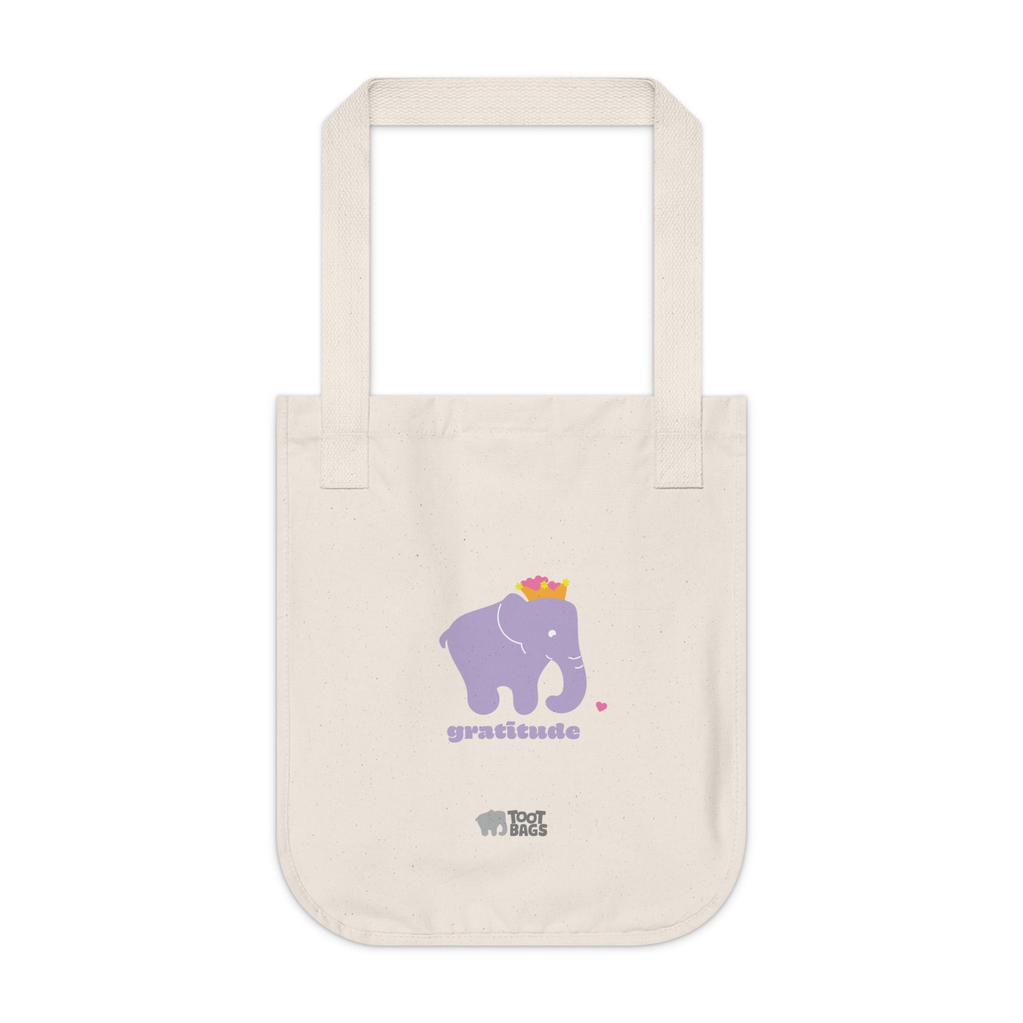 Natural beige canvas tote bag featuring a printed design; a purple elephant, purple gratitude text and colorful hearts on a white background.
