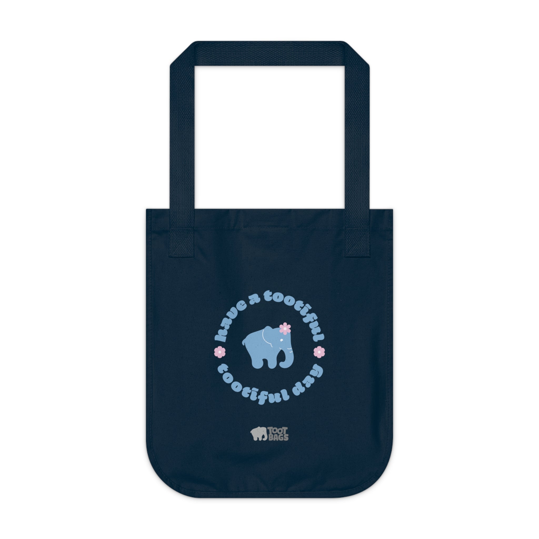 Navy blue organic canvas tote bag with a printed design featuring a blue elephant and 'have a tootiful tootiful day’ text with pink floral design on a white background.