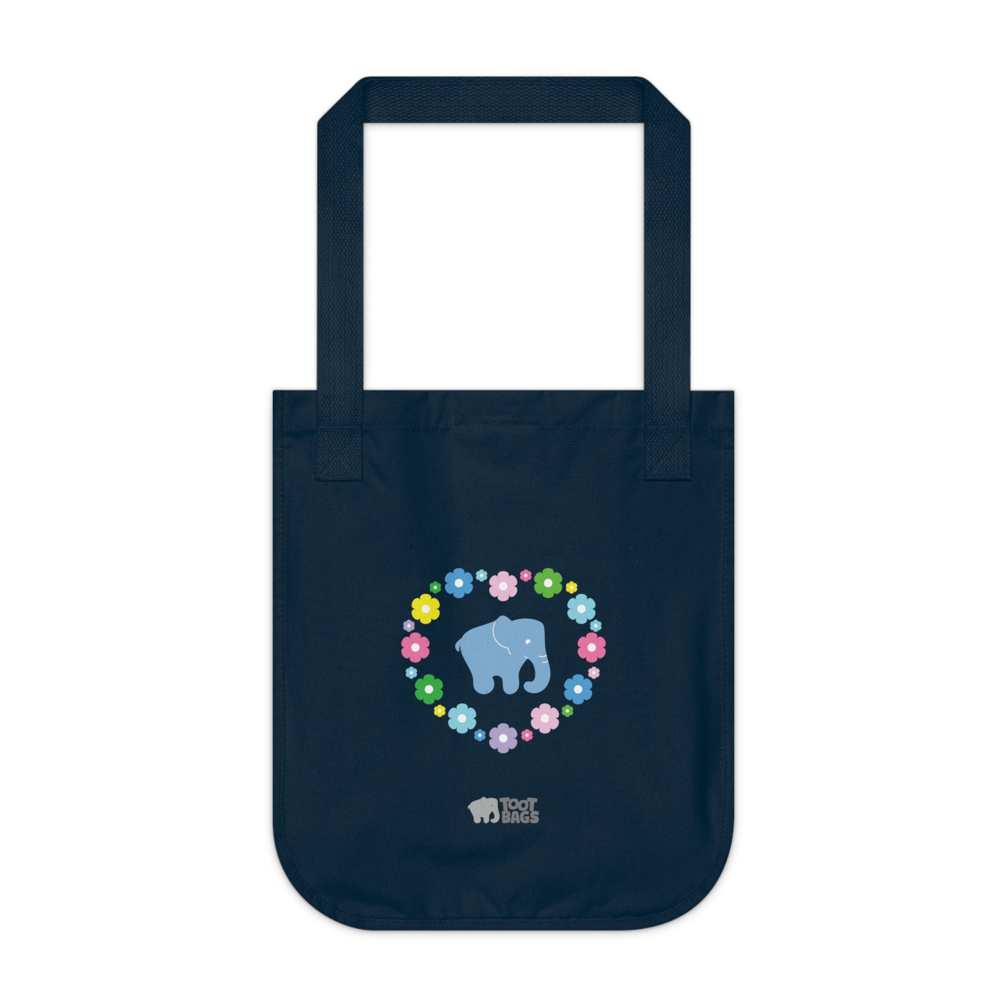 Navy blue canvas tote bag featuring a colorful printed design; a blue elephant with floral heart shaped design on a white background.  