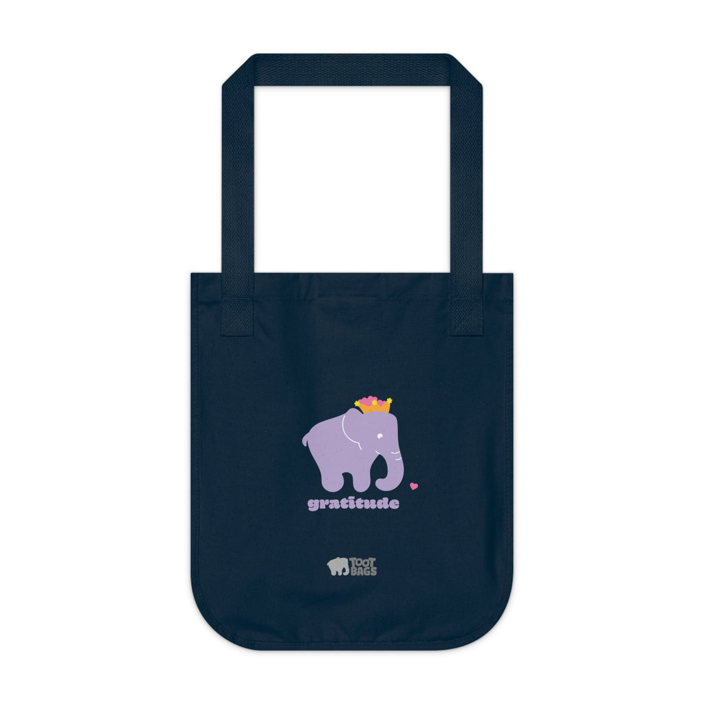 Navy canvas tote bag featuring a printed purple elephant, purple gratitude text and colorful pink hearts on a white background.